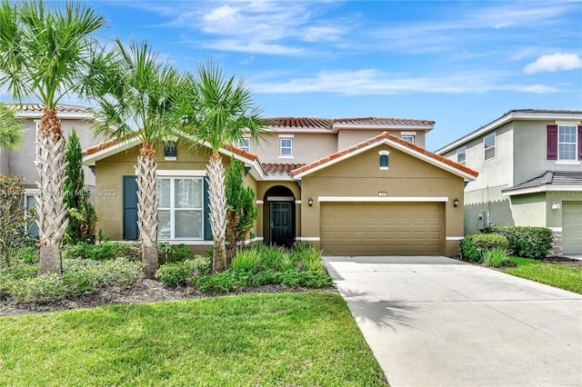 5247 Wildwood Way, Davenport, FL 33837 - mediterranean / spanish home with stucco siding, a tile roof, driveway, an attached garage, and a front lawn