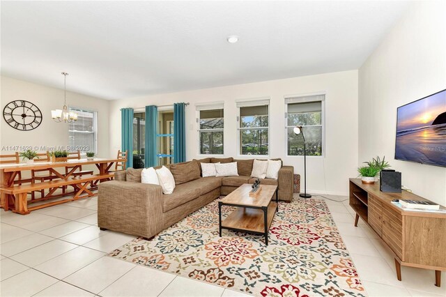 5247 Wildwood Way, Davenport, FL 33837 - living area with healthy amount of natural light, a chandelier, and light tile patterned flooring