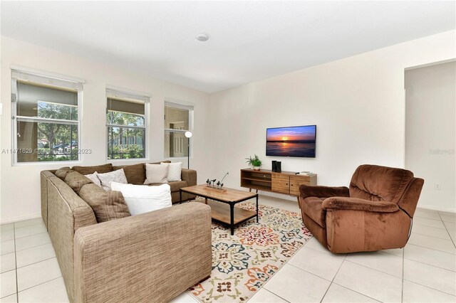 5247 Wildwood Way, Davenport, FL 33837 - living area featuring light tile patterned floors and baseboards