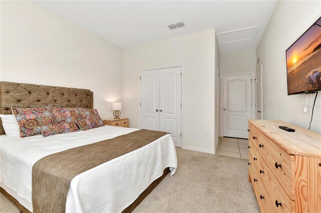 5247 Wildwood Way, Davenport, FL 33837 - bedroom featuring attic access, light carpet, a closet, and baseboards