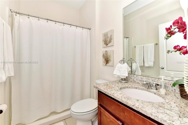 5247 Wildwood Way, Davenport, FL 33837 - bathroom with toilet, vanity, tile patterned floors, and shower / tub combo