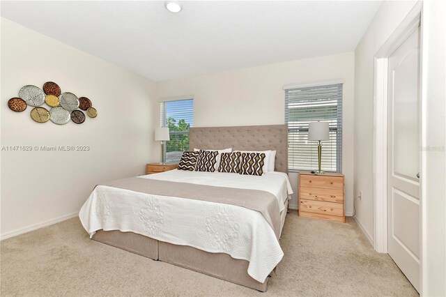 5247 Wildwood Way, Davenport, FL 33837 - bedroom featuring light colored carpet and baseboards