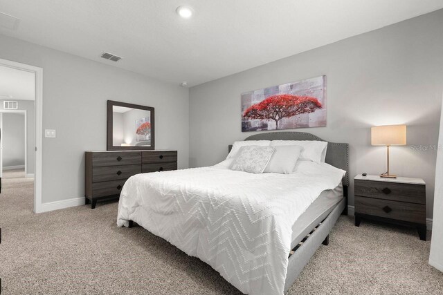 5270 Neil Dr, Saint Petersburg, FL 33714 - bedroom featuring light carpet and baseboards