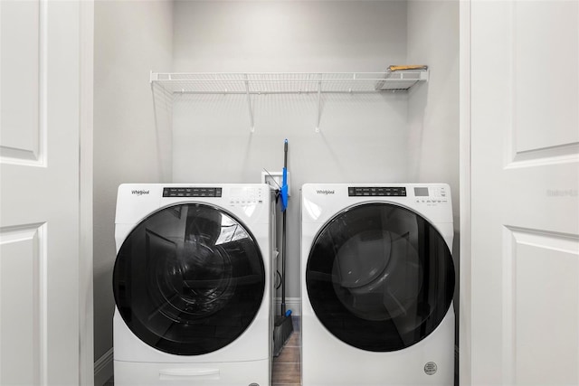 5270 Neil Dr, Saint Petersburg, FL 33714 - laundry room with washing machine and dryer and wood finished floors