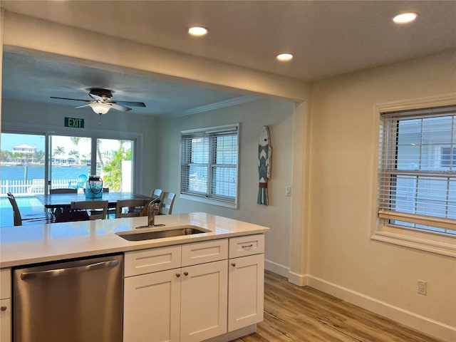 474 20th Ave, Indian Rocks Beach, FL 33785 - kitchen featuring stainless steel dishwasher, a sink, light countertops, baseboards, and recessed lighting