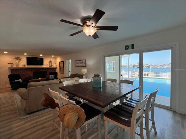 474 20th Ave, Indian Rocks Beach, FL 33785 - dining area with wood finished floors, a ceiling fan, a water view, and recessed lighting