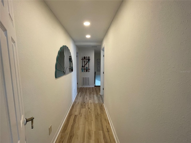 474 20th Ave, Indian Rocks Beach, FL 33785 - hall with light wood-type flooring, baseboards, and recessed lighting