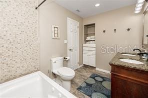 474 20th Ave, Indian Rocks Beach, FL 33785 - full bath with double vanity, toilet, a bath, and a shower