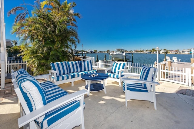 474 20th Ave, Indian Rocks Beach, FL 33785 - view of patio / terrace featuring outdoor lounge area, a water view, a dock, and boat lift