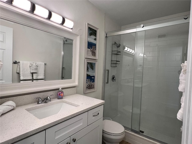 474 20th Ave, Indian Rocks Beach, FL 33785 - bathroom featuring vanity, a stall shower, and toilet