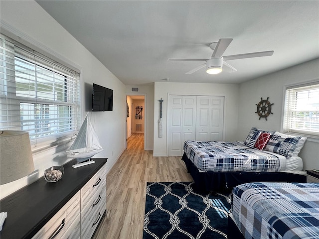 474 20th Ave, Indian Rocks Beach, FL 33785 - bedroom with light wood-type flooring, a closet, and a ceiling fan