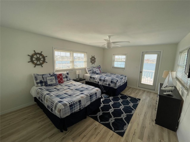 474 20th Ave, Indian Rocks Beach, FL 33785 - bedroom with light wood-style floors, baseboards, and ceiling fan