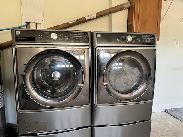 474 20th Ave, Indian Rocks Beach, FL 33785 - washroom featuring washer and clothes dryer, baseboards, and cabinet space
