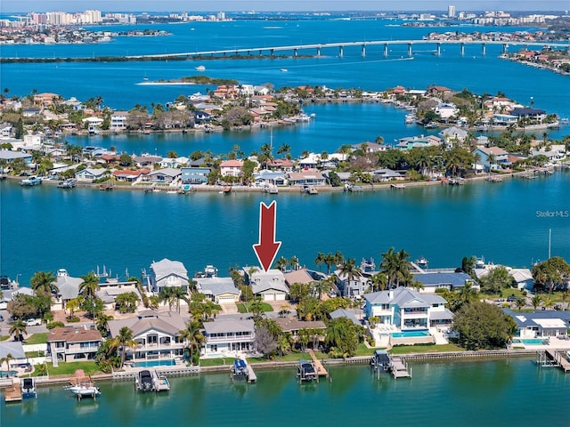 474 20th Ave, Indian Rocks Beach, FL 33785 - aerial perspective of suburban area featuring a nearby body of water and a notable bridge