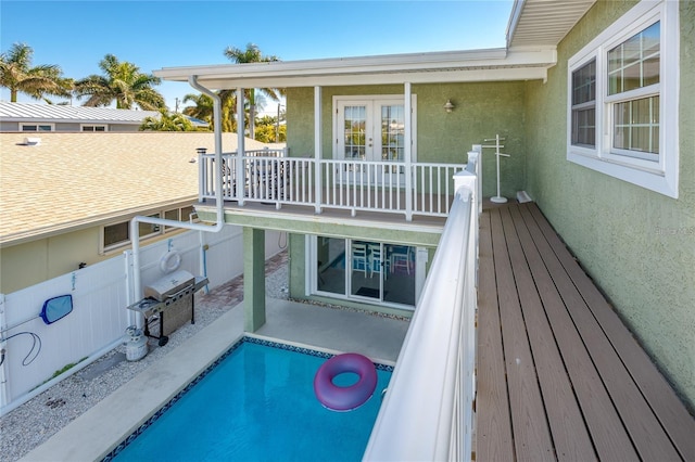 474 20th Ave, Indian Rocks Beach, FL 33785 - wooden terrace with french doors and a patio