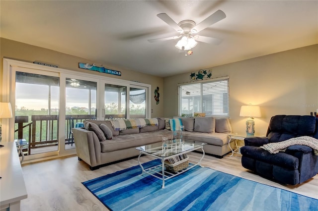 9484 Tara Cay Ct Unit 8, Seminole, FL 33776 - living area with light wood-style floors and a ceiling fan