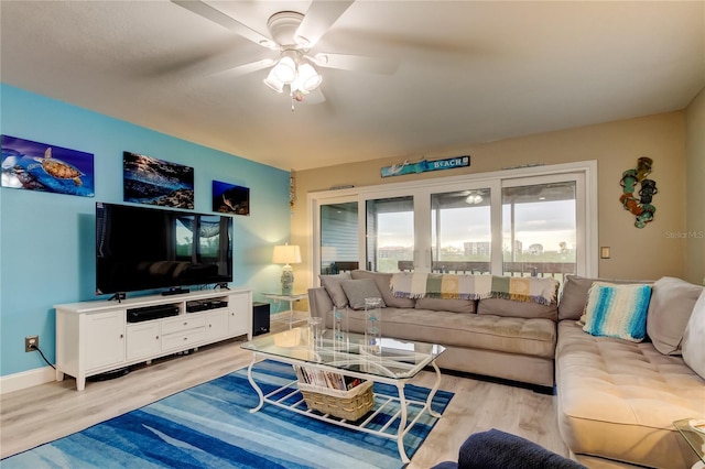 9484 Tara Cay Ct Unit 8, Seminole, FL 33776 - living room with light wood-style floors, a ceiling fan, and baseboards