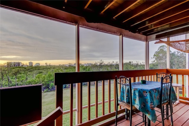 9484 Tara Cay Ct Unit 8, Seminole, FL 33776 - wooden deck featuring outdoor dining space and a lawn
