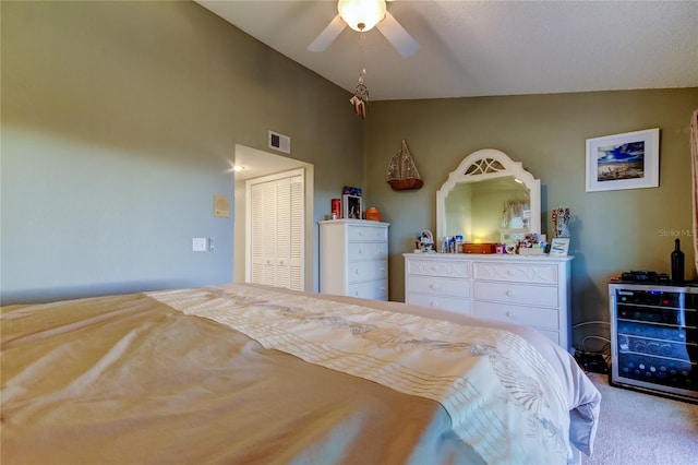 9484 Tara Cay Ct Unit 8, Seminole, FL 33776 - bedroom featuring carpet flooring, vaulted ceiling, beverage cooler, and a ceiling fan