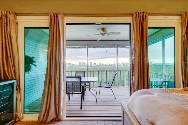 9484 Tara Cay Ct Unit 8, Seminole, FL 33776 - bedroom featuring access to exterior and ceiling fan