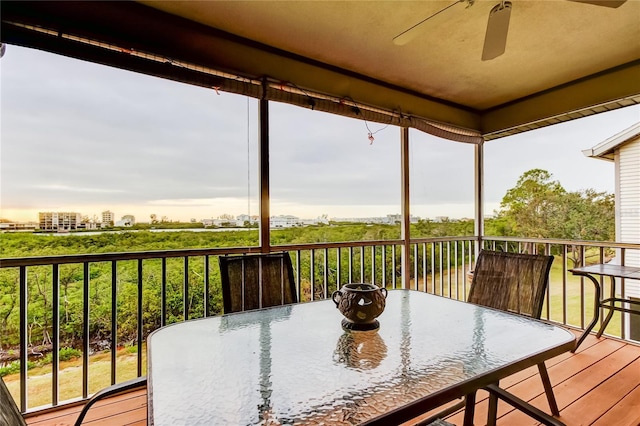 9484 Tara Cay Ct Unit 8, Seminole, FL 33776 - wooden deck with a ceiling fan and outdoor dining area