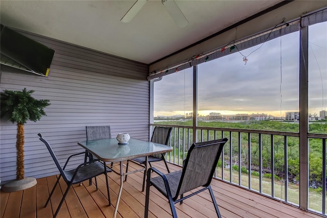 9484 Tara Cay Ct Unit 8, Seminole, FL 33776 - sunroom featuring a ceiling fan and outdoor dining area