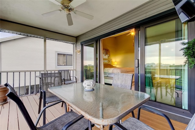 9484 Tara Cay Ct Unit 8, Seminole, FL 33776 - sunroom featuring ceiling fan and outdoor dining space