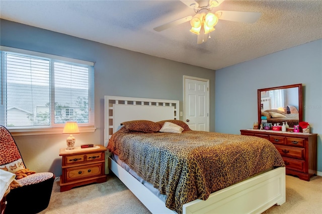 9484 Tara Cay Ct Unit 8, Seminole, FL 33776 - bedroom with light colored carpet and a ceiling fan