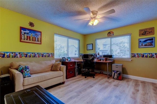 9484 Tara Cay Ct Unit 8, Seminole, FL 33776 - office space with wood finished floors, a ceiling fan, a textured ceiling, and baseboards