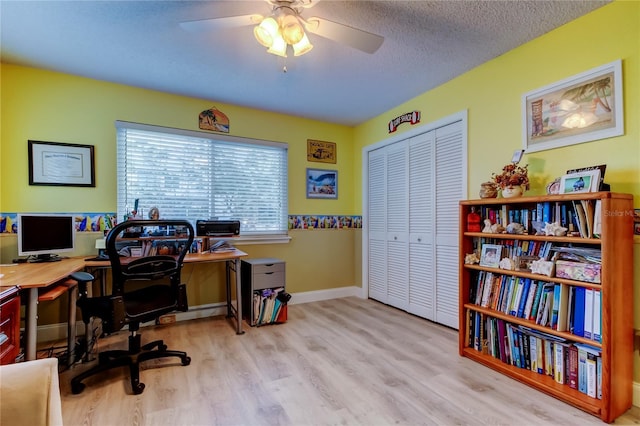 9484 Tara Cay Ct Unit 8, Seminole, FL 33776 - office area featuring wood finished floors, ceiling fan, baseboards, and a textured ceiling