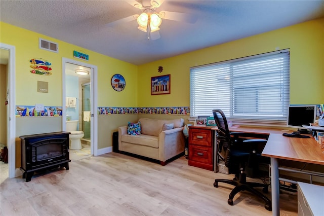 9484 Tara Cay Ct Unit 8, Seminole, FL 33776 - office space featuring wood finished floors, ceiling fan, and a textured ceiling