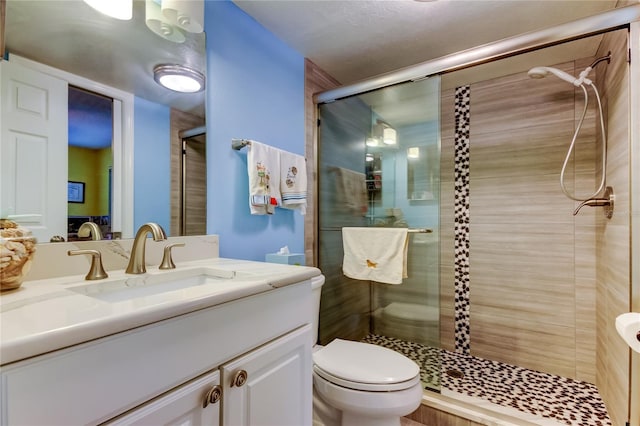 9484 Tara Cay Ct Unit 8, Seminole, FL 33776 - bathroom with a stall shower, toilet, and vanity