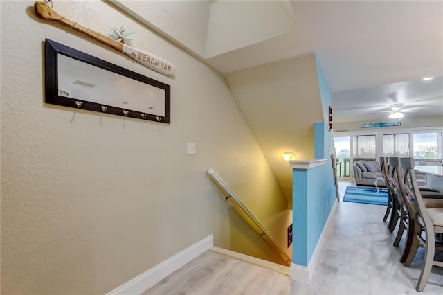 9484 Tara Cay Ct Unit 8, Seminole, FL 33776 - staircase with wood finished floors, baseboards, and ceiling fan