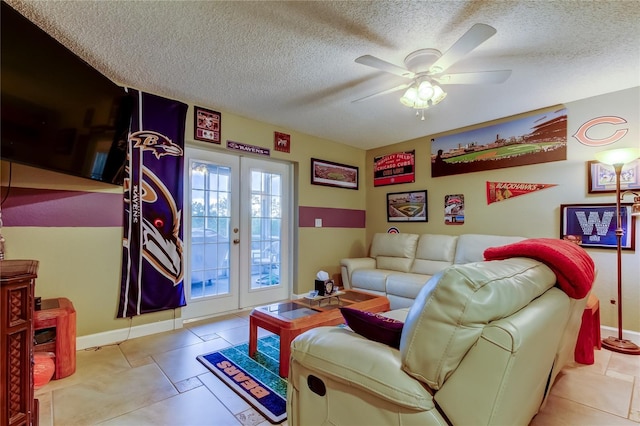9484 Tara Cay Ct Unit 8, Seminole, FL 33776 - living room featuring a ceiling fan, a textured ceiling, french doors, tile patterned flooring, and baseboards