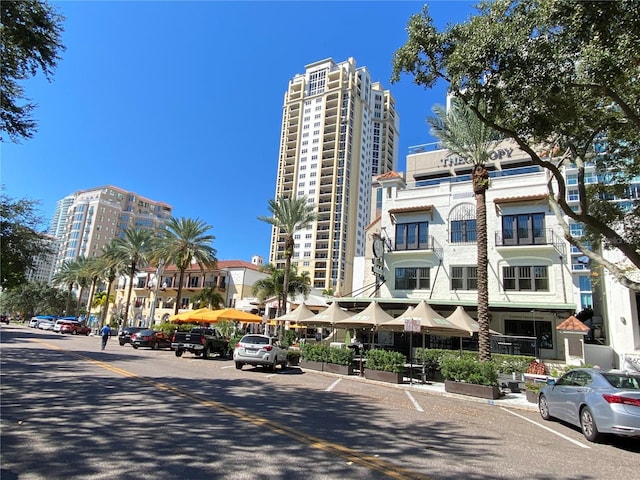 9484 Tara Cay Ct Unit 8, Seminole, FL 33776 - view of building exterior with a view of city