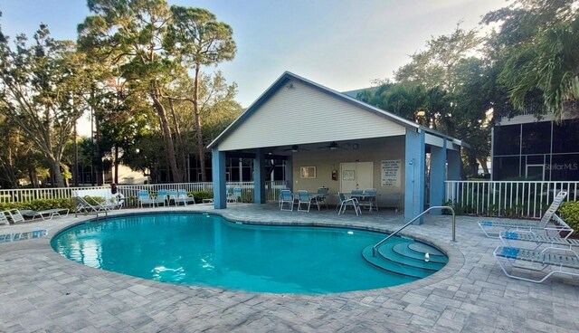9484 Tara Cay Ct Unit 8, Seminole, FL 33776 - community pool with fence, a patio, and ceiling fan