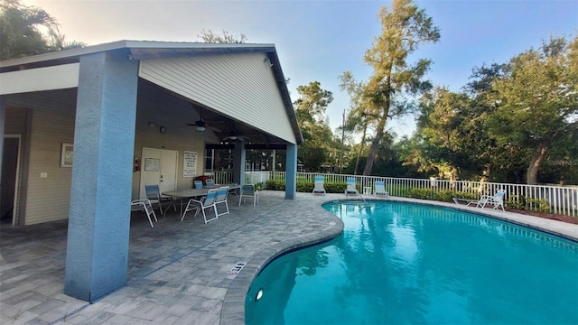 9484 Tara Cay Ct Unit 8, Seminole, FL 33776 - community pool featuring fence, a patio area, a ceiling fan, and outdoor dining space