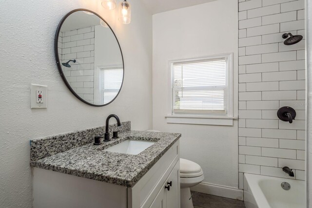 2911 16th Ave S Unit A, Saint Petersburg, FL 33712 - bathroom with toilet, vanity, and  shower combination