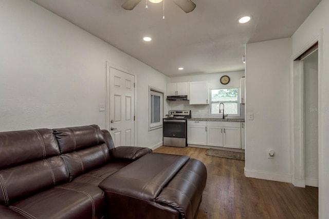 2911 16th Ave S Unit A, Saint Petersburg, FL 33712 - living room featuring wood finished floors, a ceiling fan, baseboards, and recessed lighting