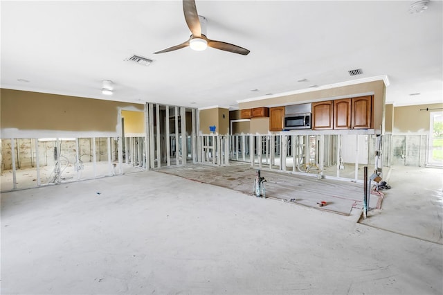 5215 Denver St NE, Saint Petersburg, FL 33703 - unfurnished living room with ceiling fan and ornamental molding