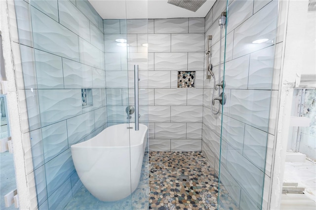 5215 Denver St NE, Saint Petersburg, FL 33703 - full bath with a shower stall, tile walls, and a freestanding bath