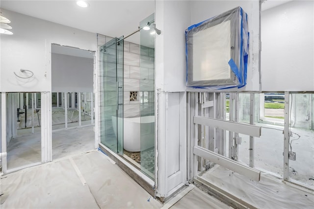 5215 Denver St NE, Saint Petersburg, FL 33703 - bathroom with a freestanding tub, concrete floors, and recessed lighting