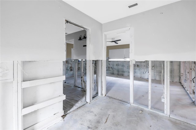 5215 Denver St NE, Saint Petersburg, FL 33703 - bathroom with a ceiling fan and concrete floors