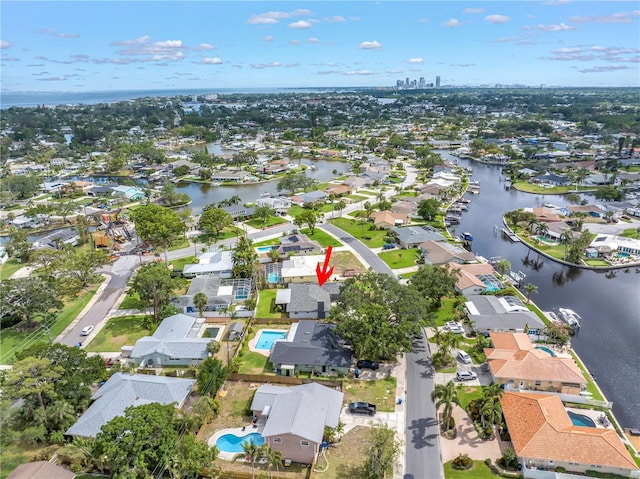 5215 Denver St NE, Saint Petersburg, FL 33703 - aerial view of property and surrounding area featuring nearby suburban area and a large body of water