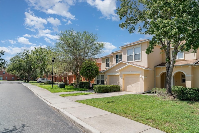 6954 Hawthorne Trace Ln, Riverview, FL 33578 - view of front of property featuring concrete driveway, a garage, stucco siding, a front lawn, and a residential view