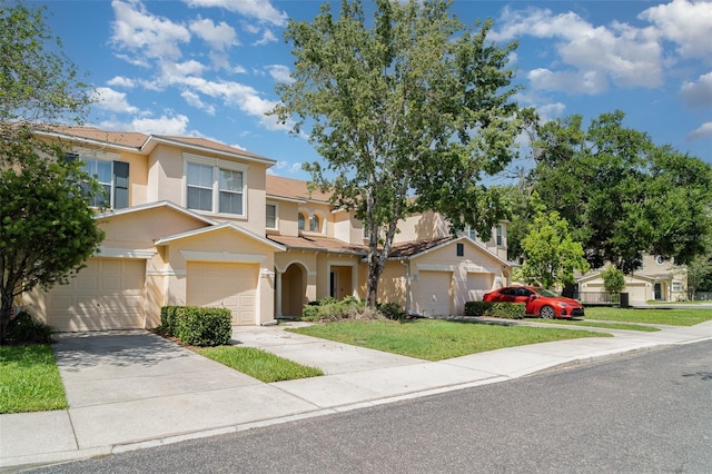 6954 Hawthorne Trace Ln, Riverview, FL 33578 - view of front facade featuring stucco siding, concrete driveway, an attached garage, and a front lawn