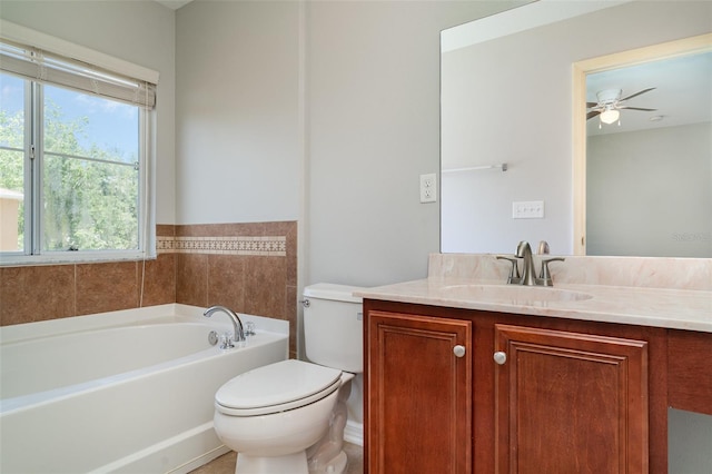 6954 Hawthorne Trace Ln, Riverview, FL 33578 - bathroom featuring a garden tub, toilet, vanity, and a ceiling fan