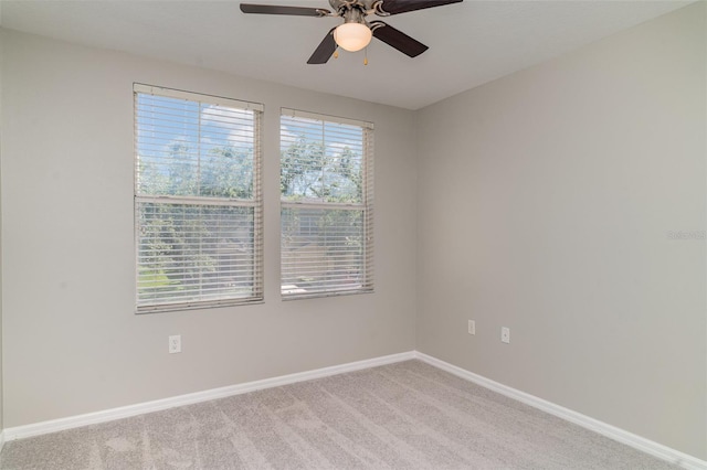 6954 Hawthorne Trace Ln, Riverview, FL 33578 - empty room featuring light colored carpet, a ceiling fan, and baseboards