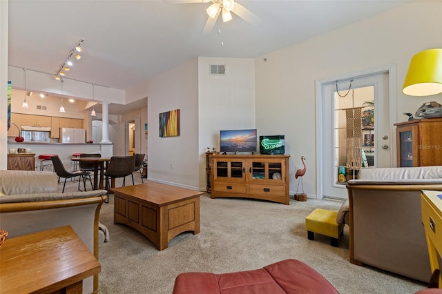 200 4th Ave S Unit 220, Saint Petersburg, FL 33701 - living room featuring ceiling fan, carpet floors, decorative columns, and rail lighting
