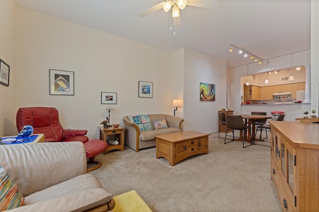 200 4th Ave S Unit 220, Saint Petersburg, FL 33701 - living room featuring light carpet, track lighting, and ceiling fan